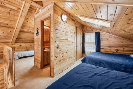 The loft contains two bedrooms, a half bathroom and a walk-through closet. Skylights on both sides allow natural sunlight in. Move the bed to be situated under them, and you can star gaze from the comfort of your bed.