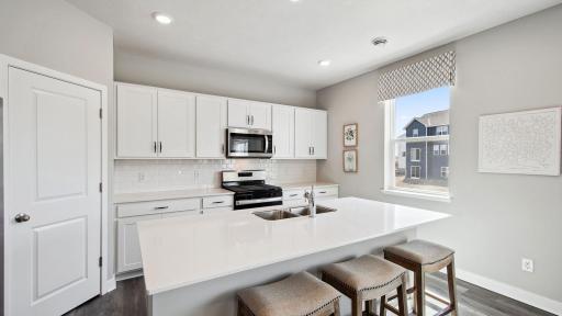 Ample storage in this kitchen between the cabinet space and the walk-in pantry offer an ideal space for any cook or baker. *Photos are of model home, finishes in actual home may vary.