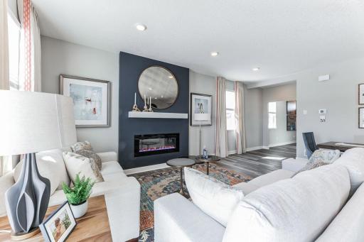 One centerpiece of this amazing living room is the customizable electric fireplace - change the color of the flame and rocks to fit the season or your mood.