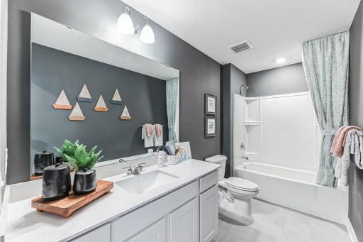 Upstairs full bath with oversized vanity makes a great place to prepare for the day.
