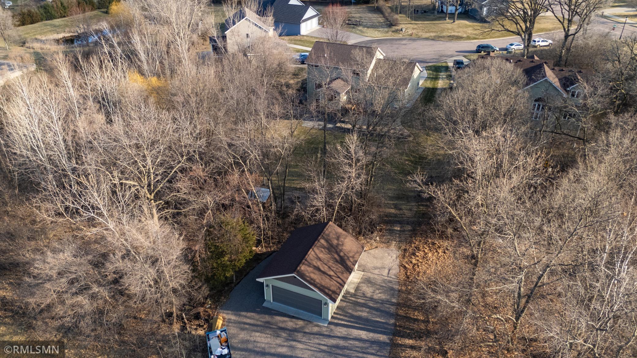 large wooden lot with 24x24 detached garage