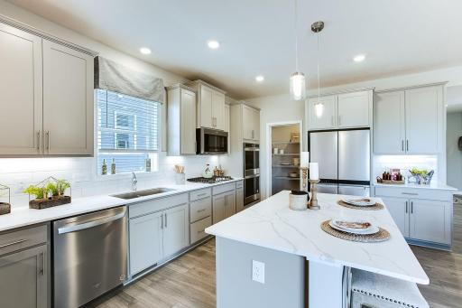 Stunning signature kitchen! *Photos of a similar home. Colors and options will vary.