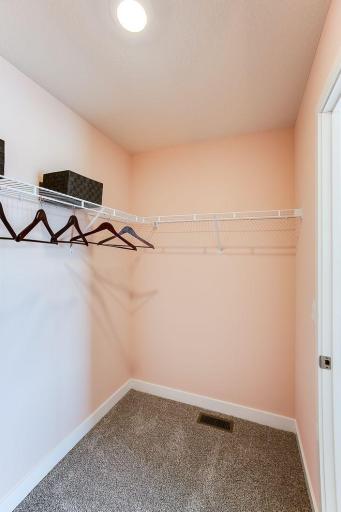 Secondary bedrooms all have walk in closets. *Photos of a similar home. Colors and options will vary.