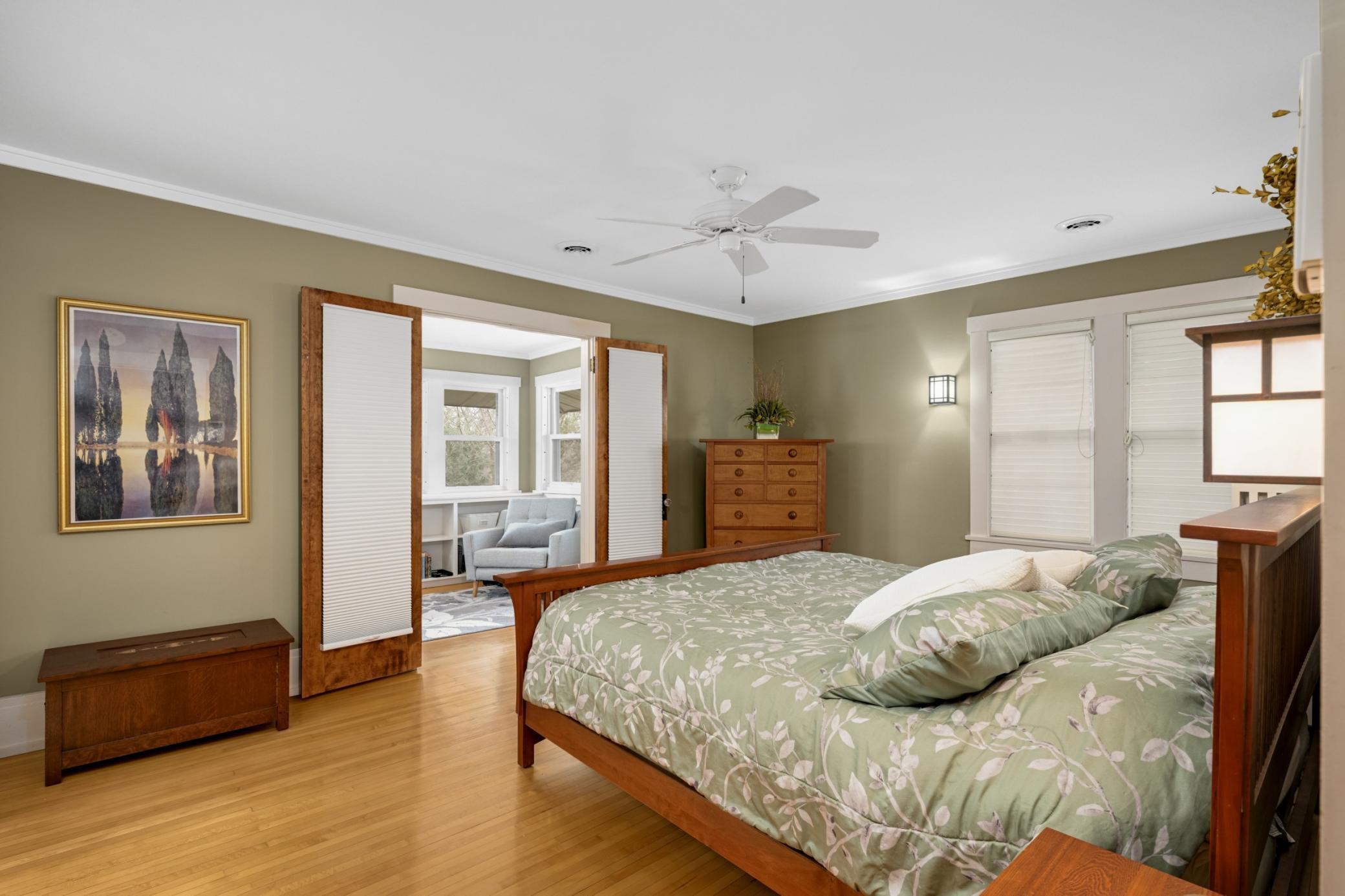 Primary bedroom with bathroom ensuite, private sunroom, and walk-in closet!