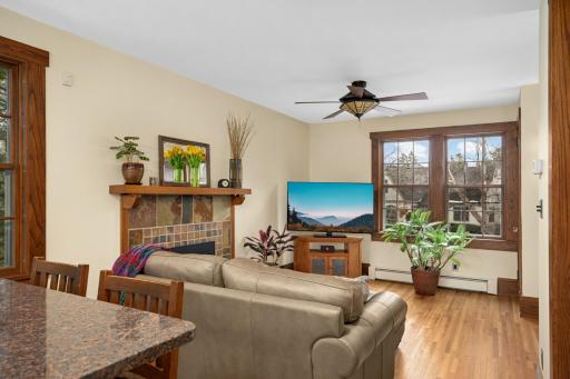 Kitchen island opens into main floor family room with Gas Fireplace.