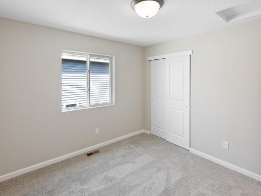 Photo of a different home with similar finishes and plan. Bedroom 3.