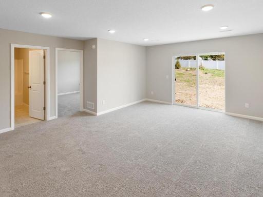 Photo of a different home with similar finishes and plan. Lower Level Family Room.