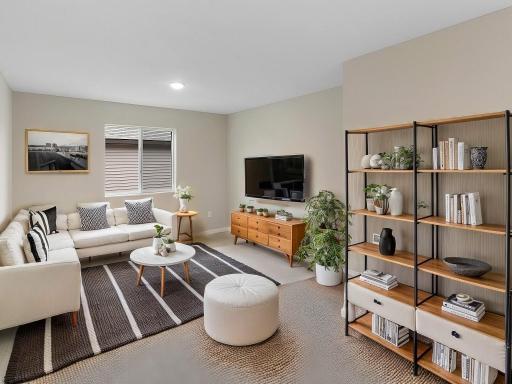 Virtually staged photo of a different home with similar finishes and plan. Upper Floor Versatile Loft.