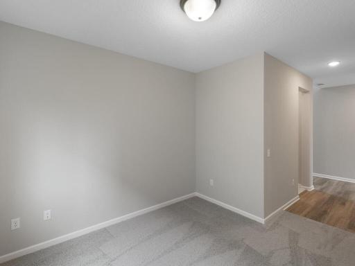 Photo of a different home with similar finishes and plan. Main Floor Flex Room.