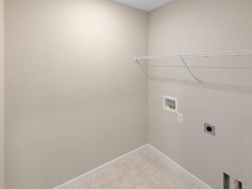 Photo of a different home with similar finishes and plan. Upper Floor Laundry Room.