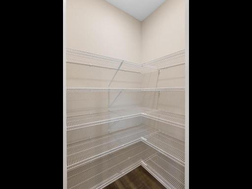 Photo of a different home with similar finishes and plan. Kitchen Walk-in Pantry.