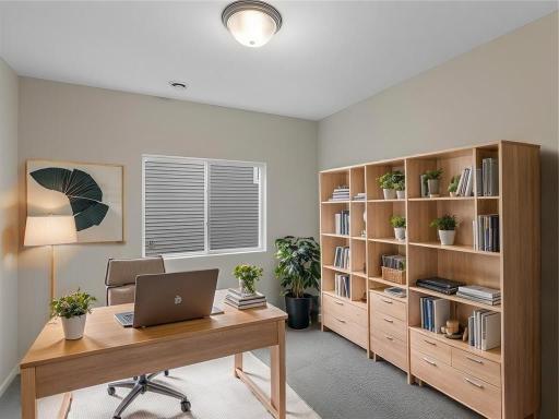 Main Level Office/Flex Room. Virtually Staged. Photo taken of another home with similar plan and finishes. Photos and renderings may not depict actual plan, materials, & finishes may vary. All measurements are approximate.