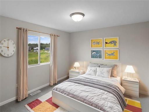 Bedroom 3. Virtually Staged. Photo taken of another home with similar plan and finishes. Photos and renderings may not depict actual plan, materials, & finishes may vary. All measurements are approximate.