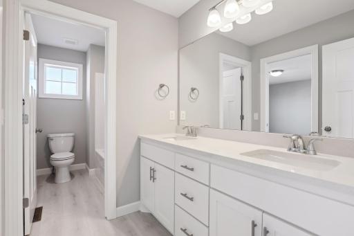 Jack-n-Jill bath on upper level. (Pic of previous model)