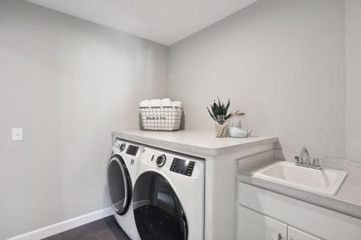Having the laundry room near all the upper level bedrooms makes laundry day a little bit easier. (Pic of previous model)