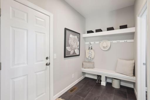 The spacious mud room helps your home stay organized. (Pic of previous model)