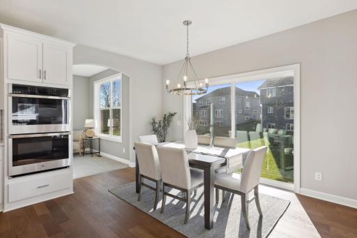 The informal dining room is just steps away from the kitchen. (Pic of a previous model)
