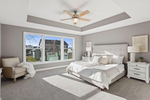 Open the grand French doors into your very own owner's suite with a private bath. (Pic of previous model)