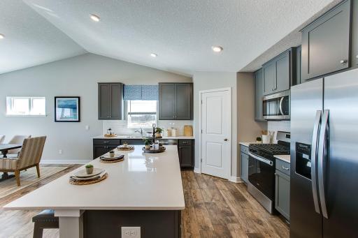 An abundance of cabinet space along with corner walk-in pantry provide all the storage you could want in a kitchen.
