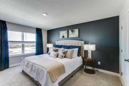 The primary bedroom, with enough space to accommodate a king sized bed.