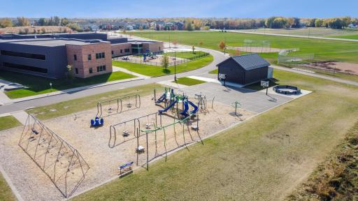 Prairie Pointe community has great access to school playground for fun outdoor time.
