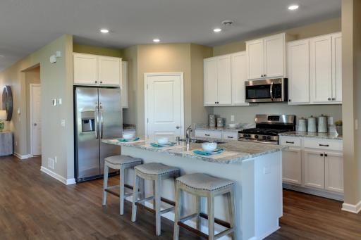Welcome to the Clayton! Take a look at this beautiful kitchen, featuring a large corner pantry! *Pictures are of model home, colors and finishes may vary. *
