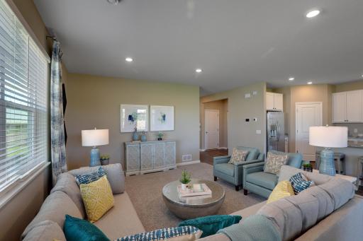 The large living room provides ample space to host gatherings. *Pictures are of model home, colors and finishes may vary. *