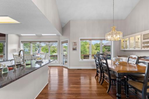 Dining area and kitchen - door leads to the huge deck with access to the backyard and lake