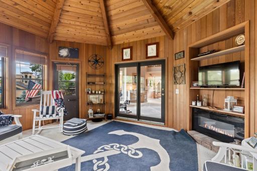 4 Season cedar porch features gas fireplace and bright!