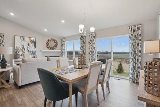 Perfectly positioned dining room. Model home photo, actual home will vary in finishes.