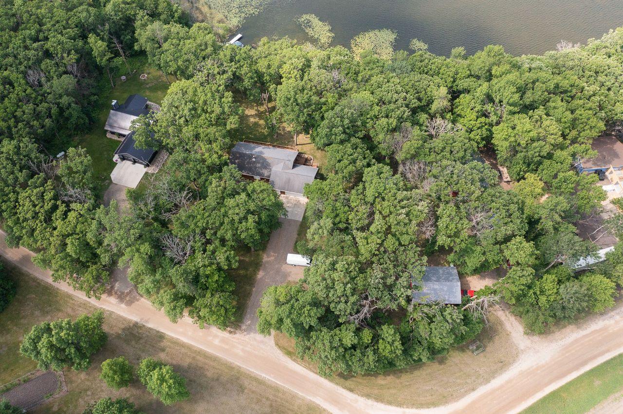 House sheltered by many trees