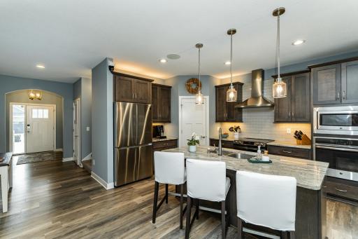 Kitchen with large center island and dedicated pantry.jpg