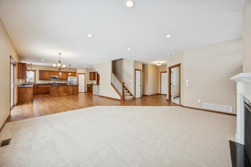 Open-concept main level designed for both everyday living and entertaining, seamlessly connecting the living room, dining area, and kitchen.
