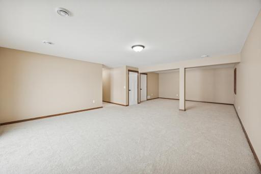Large lower-level family room with fresh carpet and open layoutâideal for entertaining, recreation, or relaxing.