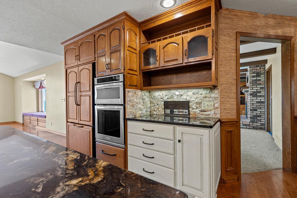 Custom built-in cabinetry with serving station, display shelving, and additional storage designed for entertaining and everyday functionality.