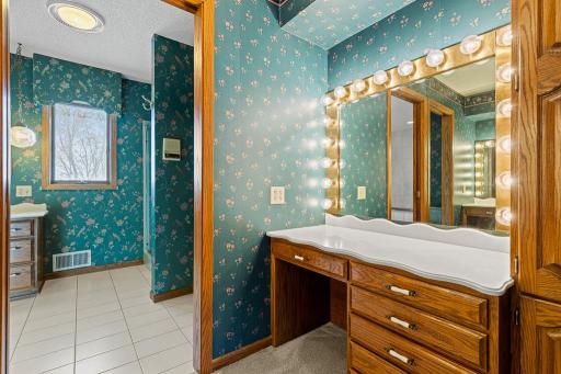Spacious primary bath featuring dual vanity space, abundant storage, and an open, functional layout.