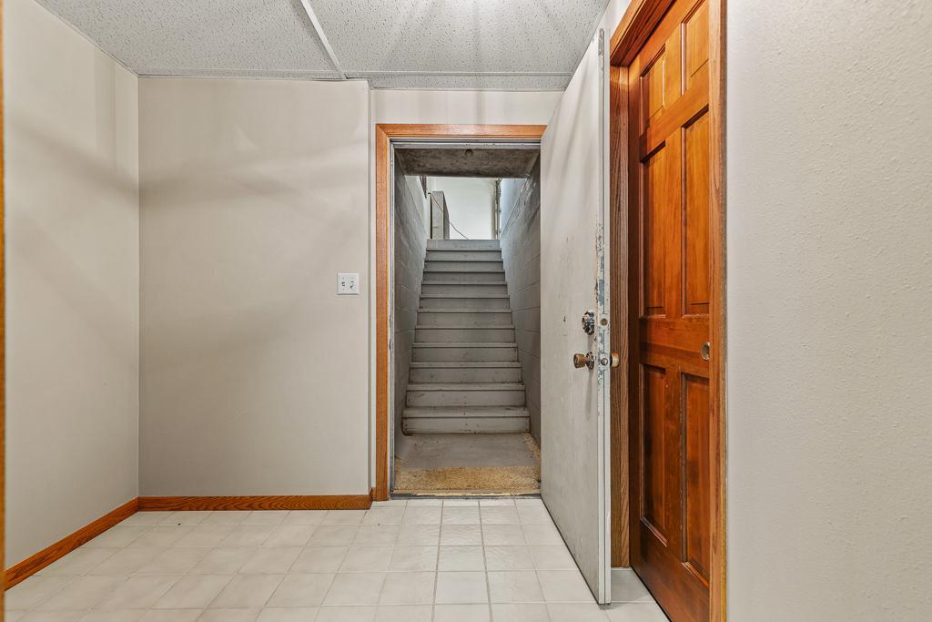 Thoughtfully designed lower level featuring direct garage access for convenience, storage, and seamless functionality.