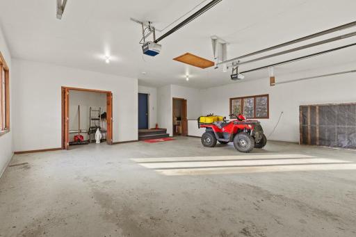 Spacious oversized garage designed for functionality with generous workspace, multiple vehicle capacity, easy access, and ample room for recreational storage and hobbies.