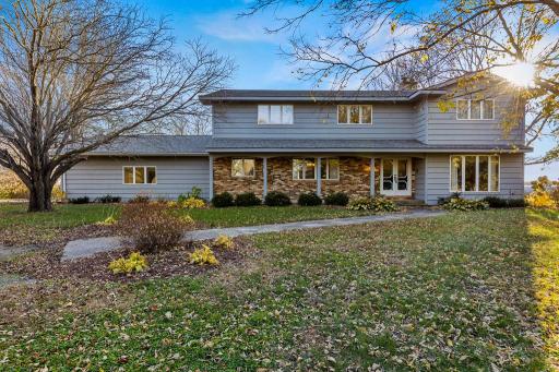 Beautifully situated on 5 scenic acres, this spacious home welcomes you with mature trees, timeless curb appeal, and a peaceful private setting.