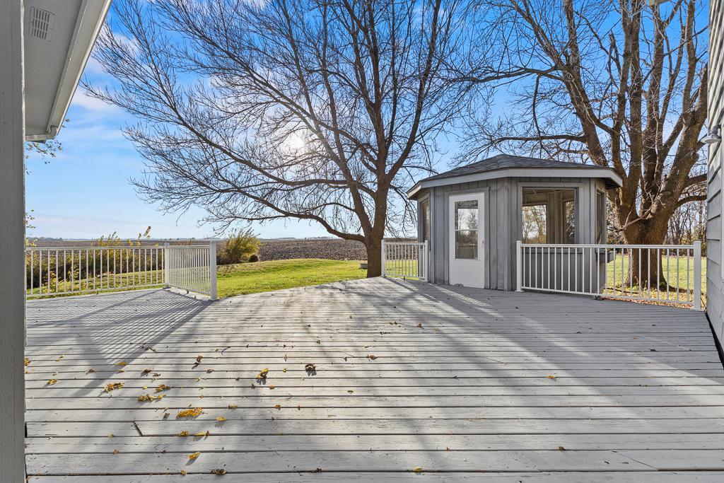 Private outdoor retreat featuring a spacious deck and charming gazebo space overlooking picturesque countryside views.
