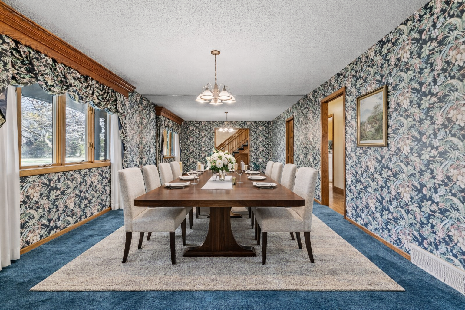 Large formal dining room with abundant natural light and generous space for entertaining, gatherings, and special occasions. virtually staged