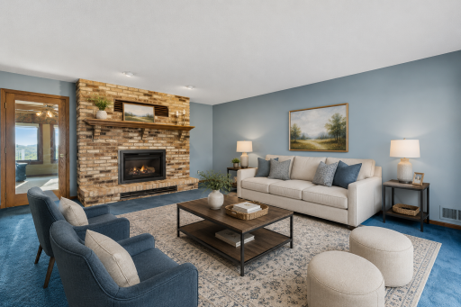 Inviting sitting area centered around a beautiful brick fireplace, creating the perfect space for relaxing and entertaining. virtually staged