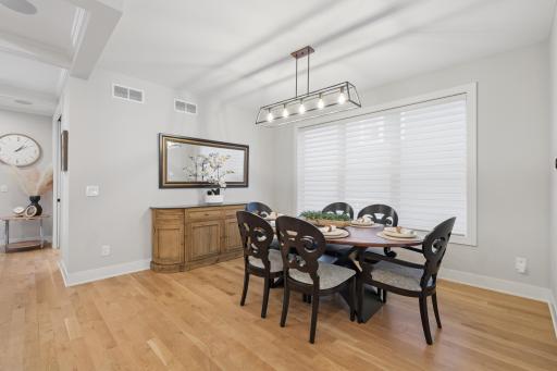 Dining area with statement lighting and generous entertaining space.