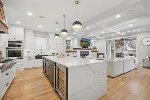 Oversized island with seating, beverage fridge and abundant prep space.
