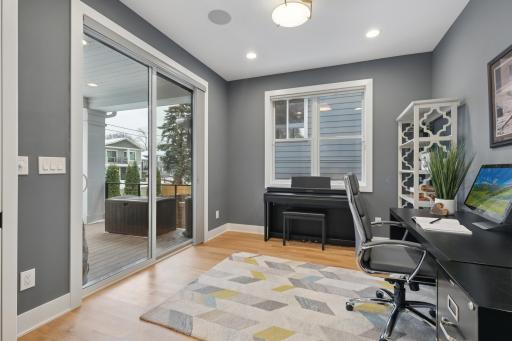 Office or flex room adjacent to the living room with pocket doors for privacy.