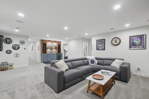Lower-level living space ideal for movie nights, games, or casual entertaining.