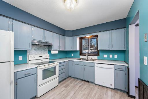 Kitchen features lots of counter and cabinet space.