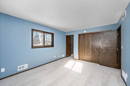 Primary bedroom features a private entrance to the bathroom, and large closet.