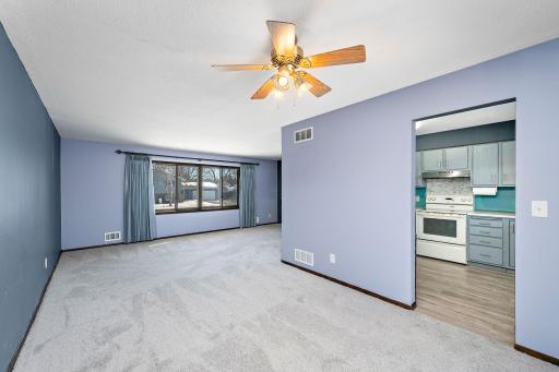 View from dining room to living room and kitchen.