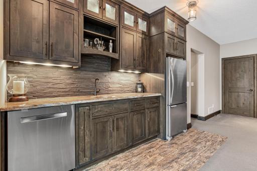 Walk-up bar complete with full refrigerator and dishwasher!